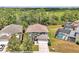 Stunning aerial view showcasing the home, lush landscaping, and a private pool area at 2747 Lido Key Dr, Kissimmee, FL 34747