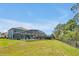 Expansive backyard with a screened-in pool area and plenty of green space; perfect for outdoor activities at 2747 Lido Key Dr, Kissimmee, FL 34747
