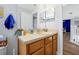 Bathroom featuring vanity with a single sink, neutral counter tops, and a decorative mirror at 2747 Lido Key Dr, Kissimmee, FL 34747