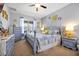 Charming bedroom with gray walls, carpet floors, and decorative sunflower wall art at 2747 Lido Key Dr, Kissimmee, FL 34747