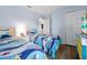 Cozy bedroom with twin beds, marine-themed bedding, and a closet for ample storage at 2747 Lido Key Dr, Kissimmee, FL 34747