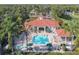 Overhead shot of the community pool and lounge area, with lush tropical landscaping at 2747 Lido Key Dr, Kissimmee, FL 34747