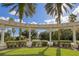 Entrance to Emerald Island under an arched sign with palm trees and blue skies at 2747 Lido Key Dr, Kissimmee, FL 34747