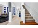 Inviting foyer with staircase and decorative niches for displaying personal items upon entry at 2747 Lido Key Dr, Kissimmee, FL 34747