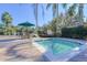 Community hot tub with palm trees and lounge chairs surrounding a peaceful area at 2747 Lido Key Dr, Kissimmee, FL 34747