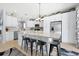 Bright kitchen featuring white cabinets, granite countertops, stainless steel appliances, and a center island at 2747 Lido Key Dr, Kissimmee, FL 34747