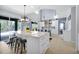 Spacious kitchen with a large central island, pendant lighting, and an adjacent dining area at 2747 Lido Key Dr, Kissimmee, FL 34747