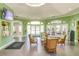 Lobby area with wicker chairs and doors leading to the fitness center and other amenities at 2747 Lido Key Dr, Kissimmee, FL 34747