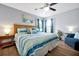 Spacious bedroom with wood floors, a ceiling fan, and comfortable seating area at 2747 Lido Key Dr, Kissimmee, FL 34747
