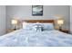 Comfortable bedroom features a decorative pillow, lamps on each bedside table, and nautical decorations at 2747 Lido Key Dr, Kissimmee, FL 34747