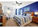 Bright main bedroom features a queen bed, wood laminate flooring, and lots of natural light at 2747 Lido Key Dr, Kissimmee, FL 34747