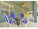 Covered patio with stylish seating and a fire pit, perfect for relaxing and enjoying the outdoors at 2747 Lido Key Dr, Kissimmee, FL 34747