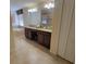 Spacious bathroom featuring double sink granite vanity, large mirror and walk-in shower at 2952 Beach Palm Ave, Kissimmee, FL 34747