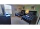 Modern twin beds with navy blue bedding and a matching nightstand at 2952 Beach Palm Ave, Kissimmee, FL 34747