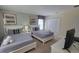 Comfortable bedroom with two twin beds, closet and soft carpet, creating a relaxing space at 2952 Beach Palm Ave, Kissimmee, FL 34747