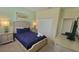 Serene bedroom with a comfortable bed and soft colors, creating a relaxing space at 2952 Beach Palm Ave, Kissimmee, FL 34747