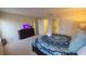 Cozy bedroom with soft carpet, TV, and bright, airy feel at 2952 Beach Palm Ave, Kissimmee, FL 34747