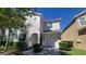 Charming two-story home with a one car garage and well-manicured landscaping at 2952 Beach Palm Ave, Kissimmee, FL 34747