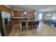 Open kitchen featuring an island with bar stool seating and ample cabinet space at 2952 Beach Palm Ave, Kissimmee, FL 34747