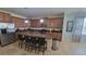 Spacious kitchen with an island, granite countertops, stainless appliances, and bar seating at 2952 Beach Palm Ave, Kissimmee, FL 34747