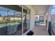 Outdoor patio leading to the pool, offering a relaxing space with comfortable seating and seamless indoor-outdoor flow at 2952 Beach Palm Ave, Kissimmee, FL 34747