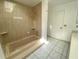 Bathroom showcasing a tiled shower and separate soaking tub at 308 S Shadow Bay Dr, Orlando, FL 32825