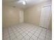 A bright bedroom with tile floors, a ceiling fan, and ample closet space at 308 S Shadow Bay Dr, Orlando, FL 32825