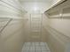 Walk-in closet featuring shelving and rod for clothes and storage at 308 S Shadow Bay Dr, Orlando, FL 32825
