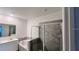 Bathroom featuring a double sink, tub and standing shower with glass doors at 312 Nine Iron Dr, Davenport, FL 33896