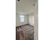 Bedroom with plush brown carpeting and a window that allows natural light. Modern door at 312 Nine Iron Dr, Davenport, FL 33896