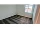 A minimalistic bedroom features carpet flooring, a window, and a bright interior at 312 Nine Iron Dr, Davenport, FL 33896