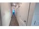 A carpeted hallway with white walls provides access to other rooms at 312 Nine Iron Dr, Davenport, FL 33896