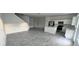 A contemporary kitchen features white cabinets, a center island, and tile flooring at 312 Nine Iron Dr, Davenport, FL 33896