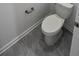 Bathroom featuring toilet and gray tiled flooring at 312 Nine Iron Dr, Davenport, FL 33896