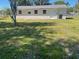 The backyard has a large grassy area perfect for children and pets to play at 3135 Old Dixie Hwy, Auburndale, FL 33823