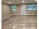 A bright living area offers wood-look floors and a freshly painted interior at 3135 Old Dixie Hwy, Auburndale, FL 33823
