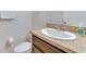 Bathroom featuring a single sink vanity with a white sink and a tan countertop at 314 Annabelle Way, Davenport, FL 33837