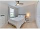 Bedroom featuring a ceiling fan, a window with curtains, and neutral-colored carpet at 314 Annabelle Way, Davenport, FL 33837