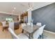 Bright dining area featuring a modern light fixture, stylish decor, and easy access to the kitchen at 314 Annabelle Way, Davenport, FL 33837