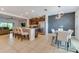 Open-concept kitchen and dining area featuring modern appliances and stylish decor at 314 Annabelle Way, Davenport, FL 33837