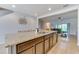 Spacious kitchen with a large island, granite countertops, stainless steel appliances, and an open floor plan at 314 Annabelle Way, Davenport, FL 33837