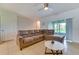 Cozy living room featuring a comfortable sectional sofa and sliding glass doors to the patio at 314 Annabelle Way, Davenport, FL 33837