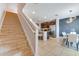 Open floor plan living space with stairs leading up to other floors and an open kitchen at 314 Annabelle Way, Davenport, FL 33837