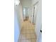 Hallway featuring tile floors and neutral walls at 3300 Whitestone Cir # 201, Kissimmee, FL 34741