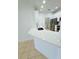 Bright kitchen featuring a breakfast bar, stainless steel appliances, and adjacent laundry area at 3300 Whitestone Cir # 201, Kissimmee, FL 34741