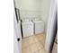 Convenient laundry room with washer, dryer, and ample space at 3300 Whitestone Cir # 201, Kissimmee, FL 34741