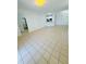 Spacious living area featuring neutral tile flooring and open concept design at 3300 Whitestone Cir # 201, Kissimmee, FL 34741