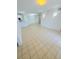 Bright living room with neutral tile floors and open floor plan with white walls at 3300 Whitestone Cir # 201, Kissimmee, FL 34741