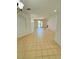 Open living area featuring neutral tile flooring, recessed lighting, and access to the balcony at 3300 Whitestone Cir # 201, Kissimmee, FL 34741