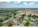 Expansive aerial view of the property showcasing its location near local amenities and lush greenery at 340 Vail Dr, Winter Haven, FL 33884